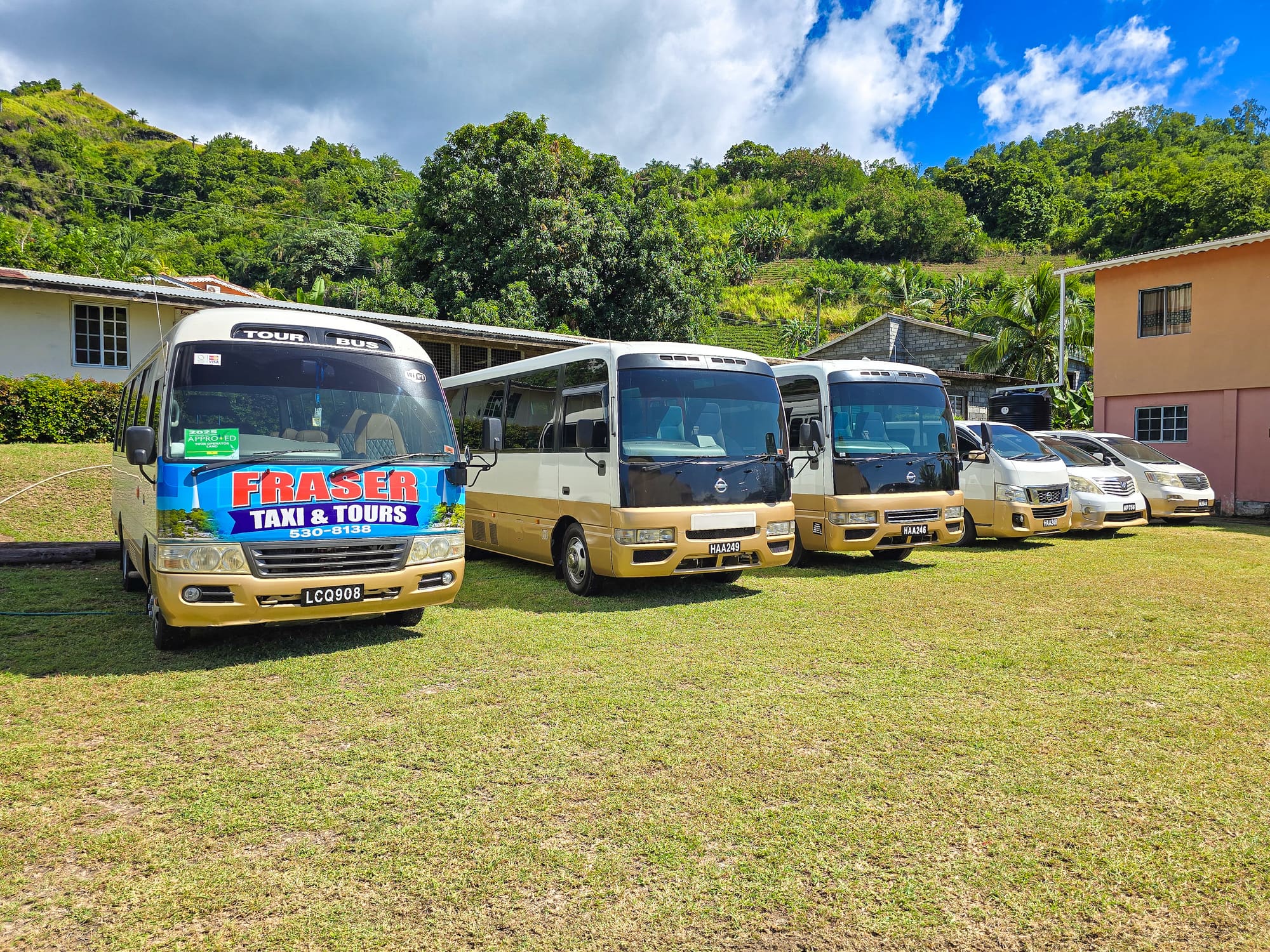 Fraser-branded Toyota Coaster leading the fleet on the property in Keartons, Barrouallie